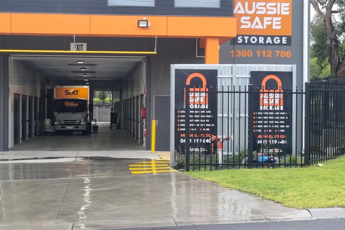 A removalist truck drives through the undercover drive-through access at Aussie Safe Storage in Pakenham, showing the 3.5m clearance available for moving house storage